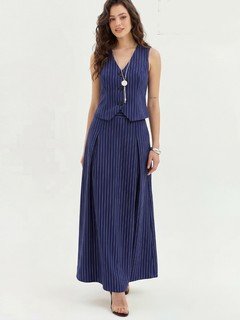 Full-length front view of the navy pinstripe vest and maxi skirt set, showing its silhouette and design details.