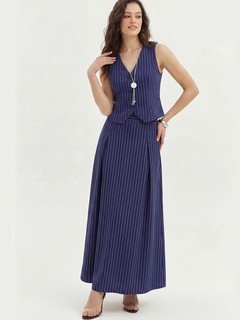 Three-quarter front view of the navy pinstripe vest and maxi skirt set, showing its silhouette and design details.