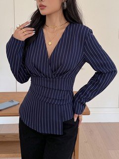 Full-length front view of the navy pinstripe ruched-waist blouse, showing its silhouette and design details.