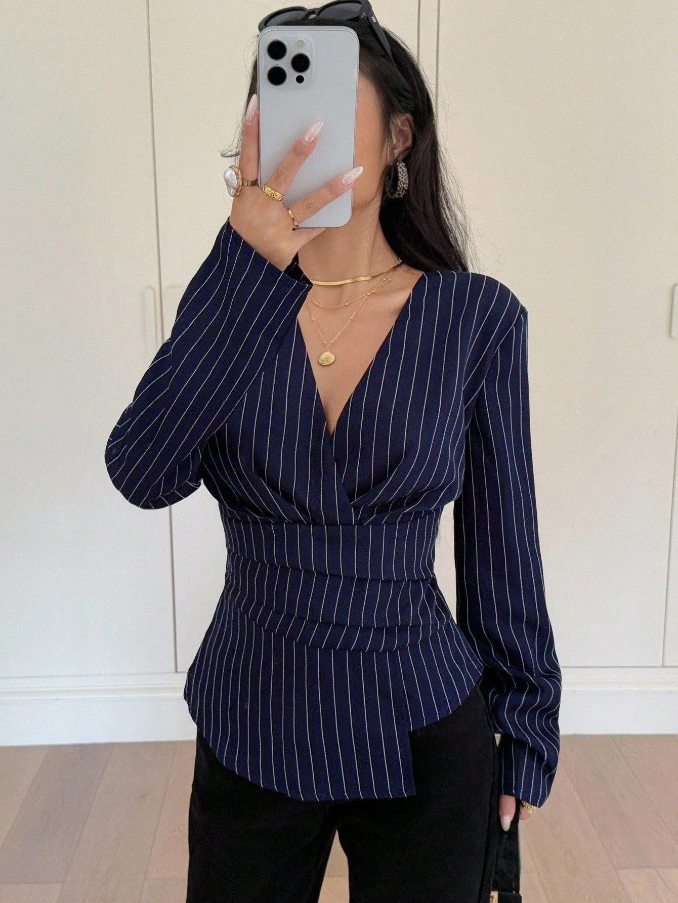Navy Pinstripe Ruched-Waist Blouse – Front View Front view of the navy pinstripe ruched-waist blouse, showing its silhouette and design details.