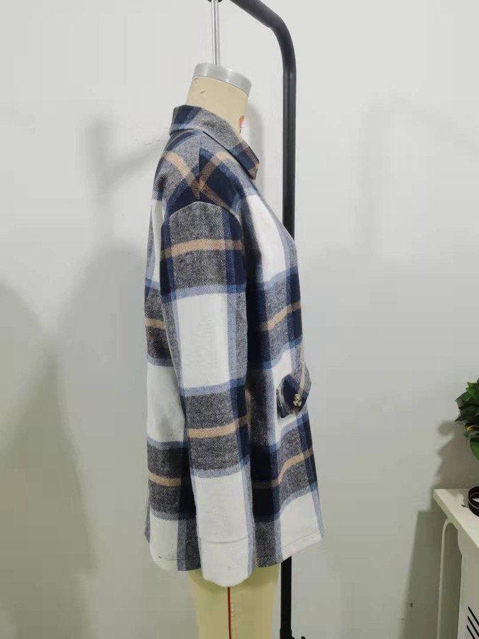 Mannequin view of the blue plaid flap-pocket shirt jacket, showing the garment shape and construction.