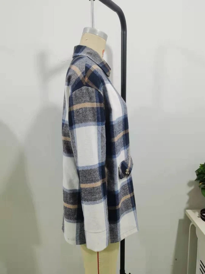 Mannequin view of the blue plaid flap-pocket shirt jacket, showing the garment shape and construction.