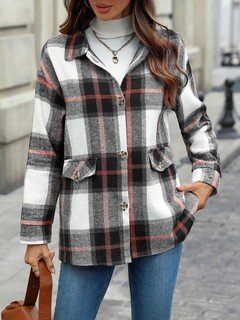 Angled front view of the black and white plaid flap-pocket shirt jacket, showing its silhouette and design details.