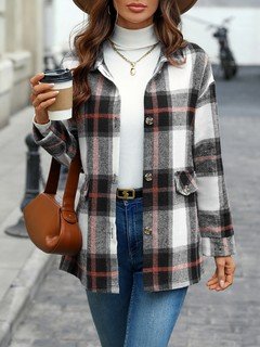 Front view of the black and white plaid flap-pocket shirt jacket, showing its silhouette and design details.
