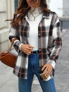 Full-length front view of the black and white plaid flap-pocket shirt jacket, showing its silhouette and design details.