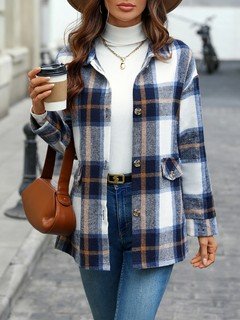Angled front view of the blue plaid flap-pocket shirt jacket, showing its silhouette and design details.
