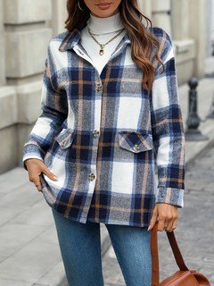 Full-length front view of the blue plaid flap-pocket shirt jacket, showing its silhouette and design details.