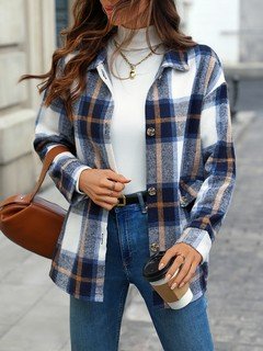 Lifestyle front view of the blue plaid flap-pocket shirt jacket, showing its silhouette and design details.