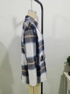 Mannequin view of the blue plaid flap-pocket shirt jacket, showing the garment shape and construction.