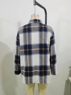 Mannequin view of the blue plaid flap-pocket shirt jacket, showing the garment shape and construction.