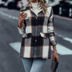 Angled front view of the navy plaid flap-pocket shirt jacket, showing its silhouette and design details.