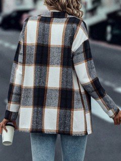 Back view of the navy plaid flap-pocket shirt jacket, showing its silhouette and design details.