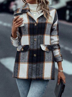 Front view of the navy plaid flap-pocket shirt jacket, showing its silhouette and design details.