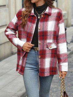 Angled front view of the red plaid flap-pocket shirt jacket, showing its silhouette and design details.