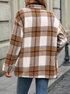 Back view of the tan plaid flap-pocket shirt jacket, showing its silhouette and design details.