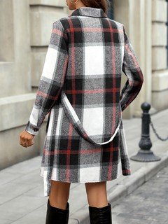 Back view of the black and white plaid belted shirt dress, showing its silhouette and design details.