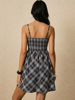 Back view of the gray and blue plaid ruched-bust mini dress, showing its silhouette and design details.