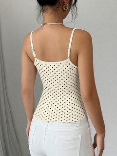 Back view of the beige polka-dot fitted camisole top, showing the silhouette and fit.