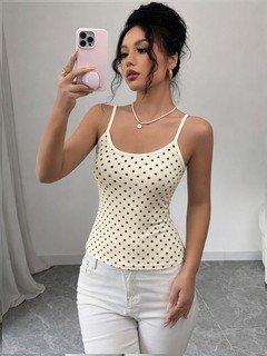 Front close up of the beige polka-dot fitted camisole top, showing polka-dot texture, slim straps and fitted shape.