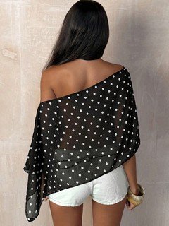 Back view of the black polka-dot asymmetric drape blouse, showing its silhouette and design details.