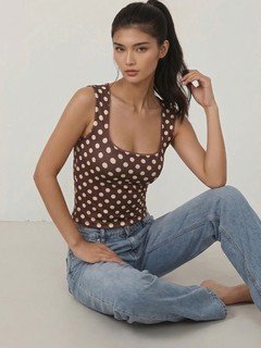 Styled front view of the brown polka-dot square-neck tank top, showing its silhouette and design details.