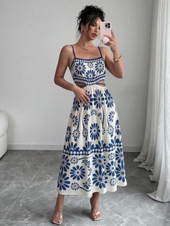 Angled front view of the blue porcelain floral-print spaghetti-strap maxi dress, showing the silhouette and fit.