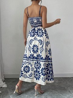 Back view of the blue porcelain floral-print spaghetti-strap maxi dress, showing the silhouette and fit.