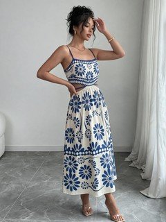 Side view of the blue porcelain floral-print spaghetti-strap maxi dress, showing the silhouette and fit.