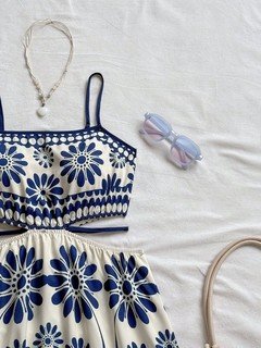 Bodice detail of the blue porcelain floral smocked-bodice spaghetti-strap maxi dress, showing smocked bodice, slim straps and porcelain floral print.