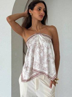 Angled front view of the beige printed halter scarf top, showing its silhouette and design details.