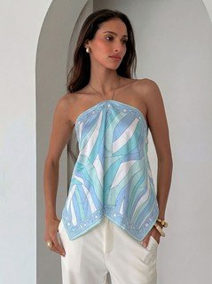 Three-quarter front view of the blue printed halter scarf top, showing its silhouette and design details.