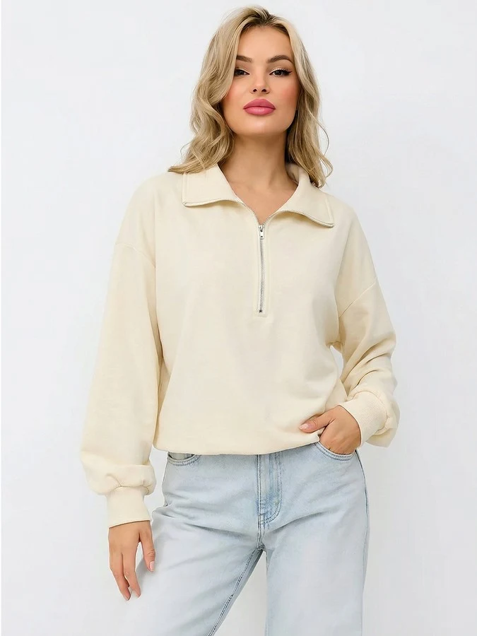 Front view of the cream quarter-zip collared sweatshirt, showing its silhouette and design details.