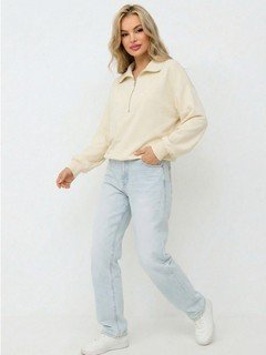 Styled front view of the cream quarter-zip collared sweatshirt, showing its silhouette and design details.
