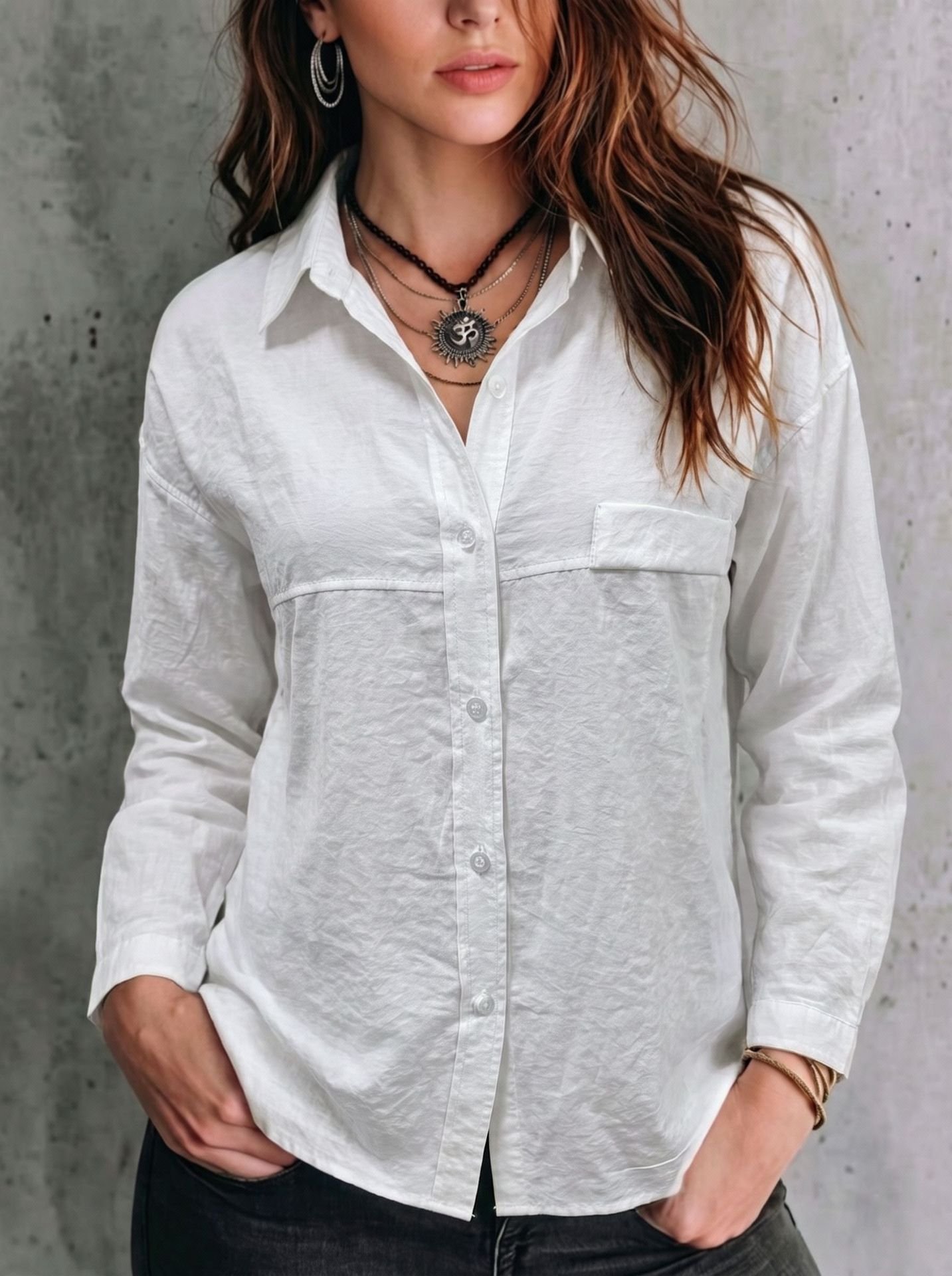 White Relaxed Button-Up Long-Sleeve Shirt – Front View Front view of the white relaxed button-up long-sleeve shirt, showing the silhouette and fit.