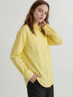 Lifestyle front view of the yellow striped button-front shirt, showing its silhouette and design details.