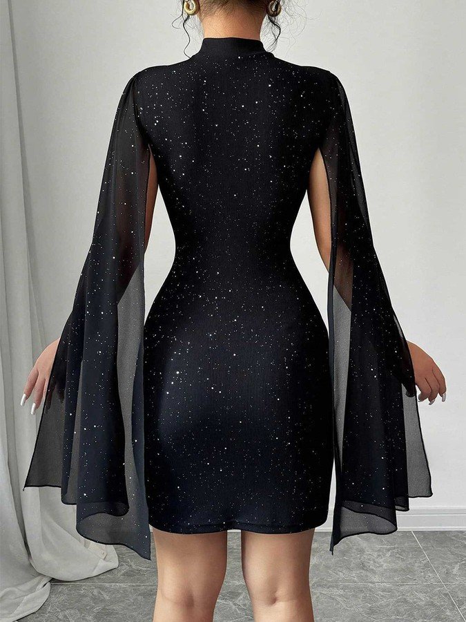 Back view of the black rhinestone cape sleeve mini dress, showing its silhouette and design details.