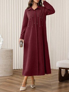 Angled front view of the burgundy rhinestone-embellished collared long-sleeve maxi dress, showing the silhouette and fit.