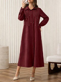 Styled front view of the burgundy rhinestone-embellished collared long-sleeve maxi dress, showing the silhouette and fit.