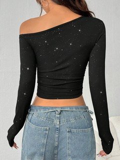 Back view of the black rhinestone one-shoulder crop top, showing its silhouette and design details.