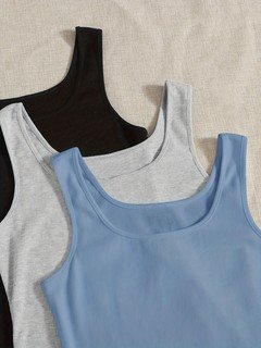 Fabric detail of the assorted colors ribbed sleeveless cropped tank top collection, showing assorted necklines, rib texture and cropped fit.