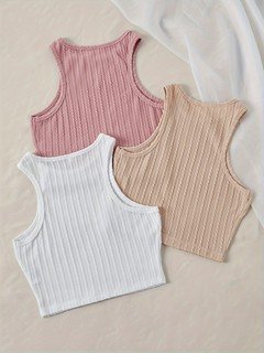 Pink flat lay of the assorted colors ribbed sleeveless cropped tank top collection, showing the garment shape and available styling.
