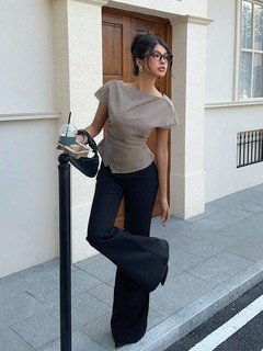 Lifestyle front view of the taupe ruched-waist short-sleeve fitted top, showing the silhouette and fit.