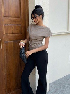 Seated front view of the taupe ruched-waist short-sleeve fitted top, showing the silhouette and fit.
