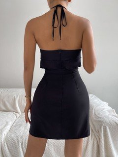 Angled front view of the black ruffle halter-neck bodycon mini dress, showing the silhouette and fit.