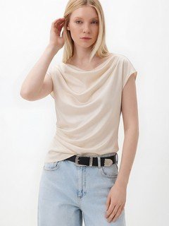 Angled front view of the champagne satin cowl-neck cap-sleeve blouse, showing its silhouette and design details.