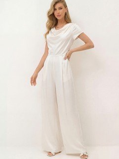 Angled front view of the ivory satin cowl-neck wide-leg jumpsuit, showing its silhouette and design details.