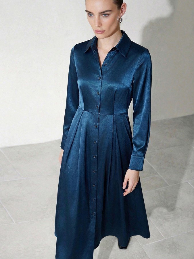 Front view of the teal satin a-line midi shirt dress, showing its silhouette and design details.