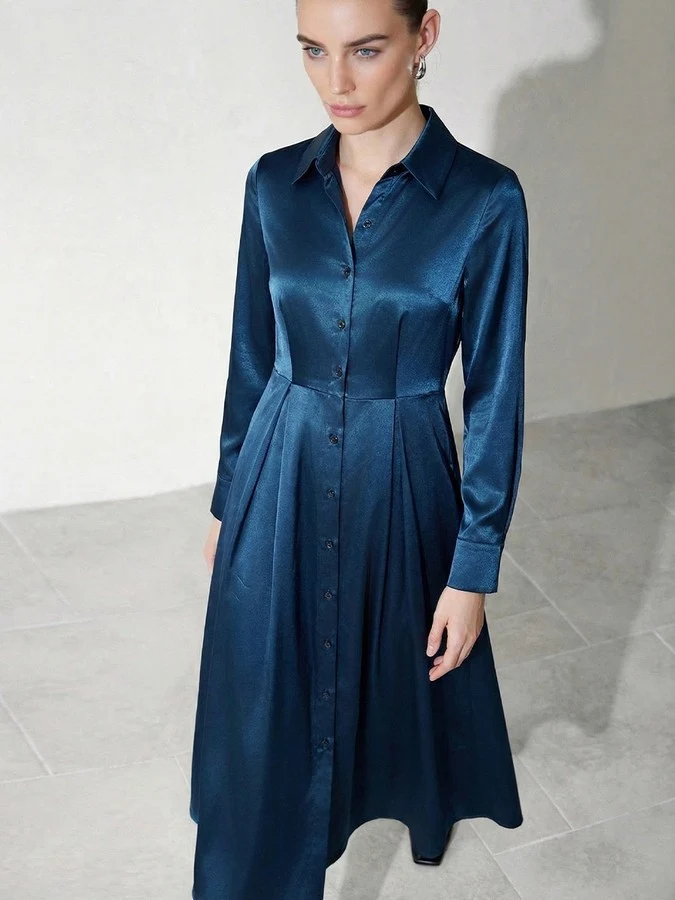 Front view of the teal satin a-line midi shirt dress, showing its silhouette and design details.