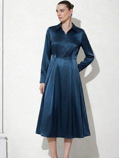 Angled front view of the teal satin a-line midi shirt dress, showing its silhouette and design details.