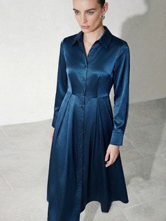 Front view of the teal satin a-line midi shirt dress, showing its silhouette and design details.
